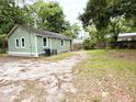 Expansive backyard with gravel and a large green space, great for outdoor activities at 307 Mill St, Walterboro, SC 29488