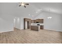 Open-concept kitchen featuring wooden cabinets, stainless appliances, granite countertops and wood floors at 321 Abercom Place Dr, Moncks Corner, SC 29461