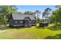 A picturesque single-Gathering home with a large yard, shed, and inviting entrance at 3399 Freeman Hill Rd, Johns Island, SC 29455