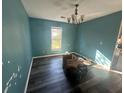 Spacious living room featuring fresh paint, ample natural light, and modern plank floors at 3801 Battleview Ct, North Charleston, SC 29420