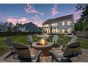 Spacious backyard featuring a cozy fire pit and ample seating for entertaining at 4019 Cascades Thrust, Summerville, SC 29483