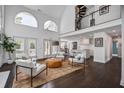 Bright living room with large windows, fireplace, and modern furnishings at 413 Station 22 1/2 St, Sullivans Island, SC 29482