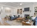 Inviting living room with built-in bookshelves, fireplace, coffered ceiling, and stylish furnishings at 4314 Grange Cir, Summerville, SC 29486