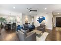 Living room showcasing an open floor plan with wood floors and lots of seating at 498 Albemarle Rd # 207, Charleston, SC 29407