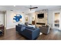 Comfortable living room featuring a fireplace, ceiling fan, and nice furniture at 498 Albemarle Rd # 207, Charleston, SC 29407