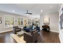 Bright living room featuring wood floors, neutral colors, and lots of natural light at 498 Albemarle Rd # 207, Charleston, SC 29407