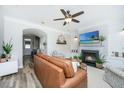Spacious living room featuring a fireplace, modern decor, and ample seating at 754 Certificate Ct, Charleston, SC 29414