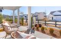 Welcoming front porch with cozy seating and landscaped surroundings, ideal for outdoor enjoyment at 782 Clay Field Trl, Summerville, SC 29485