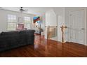 Bright living area with hardwood floors, modern decor, and ample natural light at 9206 Southern Oak Ln, Ladson, SC 29456