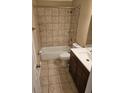 Clean bathroom featuring tiled walls, a shower-tub combo, and updated fixtures at 103 Bruce Ct, Summerville, SC 29486