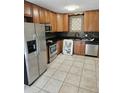 Well-lit kitchen featuring stainless steel appliances, wood cabinets, and tiled backsplash at 103 Bruce Ct, Summerville, SC 29486