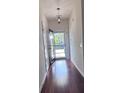 Bright entryway boasting gleaming hardwood floors and a modern door with natural light at 1297 Segar St, Johns Island, SC 29455