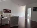 Bright living room featuring hardwood floors and an open doorway, creating a flow at 1297 Segar St, Johns Island, SC 29455