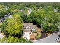 An aerial view of a beautifully landscaped property nestled among mature trees, providing privacy and a serene setting at 1337 Horseshoe Bnd, Mount Pleasant, SC 29464
