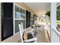 Inviting front porch with rocking chairs, cushions, and a cozy seating area at 139 Spindle Way, Goose Creek, SC 29445
