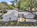 Aerial view of a fenced-in yard, patio, and two-car garage for convenient parking at 1406 Glencoe Dr, Mount Pleasant, SC 29464