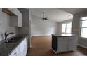 Bright kitchen with granite countertops, stainless steel appliances, and an island at 148 Lancashire Rd, Summerville, SC 29486