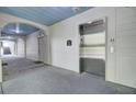 Hallway with elevator and doors, featuring blue ceiling, neutral walls, and tile accents at 2014 Basildon Rd, Mount Pleasant, SC 29466