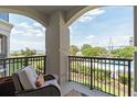 Relax on the balcony with comfortable seating and view the Ravenel Bridge at 222 S Plaza Ct, Mount Pleasant, SC 29464