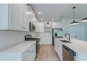 Modern kitchen featuring white cabinets, stainless steel appliances, and a gas cooktop for culinary enthusiasts at 239 Parkwood Vista Way, Summerville, SC 29486