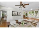 Open-concept living room features hardwood floors and plenty of natural light at 2404 Menola Ave, Charleston, SC 29414