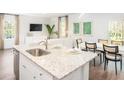 Modern kitchen with granite countertops, stainless steel appliances, and an open concept dining area at 331 Tiliwa St, Summerville, SC 29486