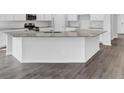 Modern kitchen island with granite countertops and stylish cabinetry at 332 Pine Crest View Dr, Summerville, SC 29486