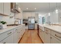 Spacious kitchen with stainless steel appliances, quartz countertops, custom backsplash, and ample storage space at 3585 Sawlog Dr, Summerville, SC 29486
