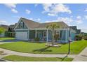 Attractive blue home featuring a lush front lawn and a welcoming porch, set on a corner lot at 3801 Canary Ct, North Charleston, SC 29420