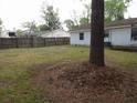 Large backyard with a wooden fence, providing privacy and ample space at 409 Robin Dr, Goose Creek, SC 29445