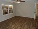 Bright bedroom with wood floors and a view from the double window at 409 Robin Dr, Goose Creek, SC 29445