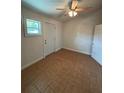 Cozy bedroom with a ceiling fan, neutral walls, and natural light coming from the window at 4324 Purdue Dr, North Charleston, SC 29418