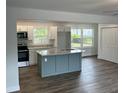 Bright, open kitchen with island, modern appliances, and ample counter space at 4626 W W Montague Ave, North Charleston, SC 29418