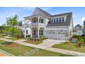 Charming two-story home with a double porch, a two-car garage, and a lush green lawn at 503 Ivy Green Ln, Summerville, SC 29486