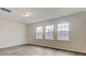 Bright bedroom featuring large windows and hardwood floors at 533 Verdi Dr, Summerville, SC 29486