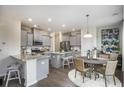 Open concept kitchen with eat-in dining area, modern lighting, and stainless steel appliances at 543 Verdi Dr, Summerville, SC 29486