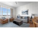 Bright living room featuring stylish furnishings, a cozy sofa, and a window with a scenic view at 5802 Palmetto Dr # B-521/519, Isle of Palms, SC 29451