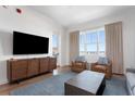 Cozy living room showcasing a large TV, comfortable seating, and a beautiful view at 5802 Palmetto Dr # B-521/519, Isle of Palms, SC 29451