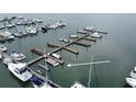 This is a detailed close-up view of boat slips with multiple boats berthed next to them in clear water at 67 W 10Th St # D-26, Folly Beach, SC 29439