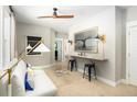 Cozy bonus room featuring a built-in desk, comfortable seating, and ample natural light at 784 Clay Field Trl, Summerville, SC 29485