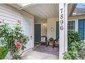 Charming porch featuring comfortable seating and decorative accents, providing a welcoming entrance at 7896 Montview Rd, North Charleston, SC 29418
