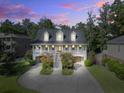 Charming two-story home with a traditional design, front porch, and landscaped front yard at 8657 Refuge Point Circle Cir, Charleston, SC 29420
