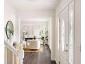 Light-filled foyer showcases a view into a sitting room and white front door at 108 Old Dominion Dr, North Charleston, SC 29418