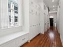 Hallway with built-in storage cabinets and hardwood flooring at 11 Franklin St, Charleston, SC 29401