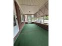 Spacious screened-in porch with neutral tones and ample natural light at 1130 Yeamans Hall Rd, Hanahan, SC 29410