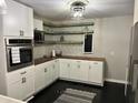 Modern kitchen featuring white cabinets, wood countertops, and stainless steel appliances at 117 Fripp Ln, Summerville, SC 29483