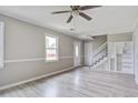 Inviting living room with a ceiling fan, light gray walls, and modern flooring at 123 Wheeler Rd, Summerville, SC 29486
