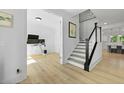 Spacious entryway featuring a staircase, office and bright flooring at 1411 Homecoming Blvd, Ravenel, SC 29470