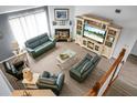Bright living room featuring modern furniture, a fireplace, and a large entertainment center at 1485 Endicot Way, Mount Pleasant, SC 29466