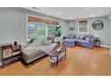Comfortable living room with large windows and hardwood floors at 1522 Inland Ave, Charleston, SC 29412